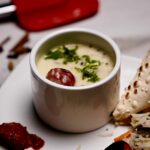 Overhead view of Gujarati Vegetable Pulao and Kadhi, showcasing colorful vegetables and creamy kadhi