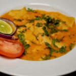 Close-up shot of Dal Dhokli, highlighting the homemade pasta pieces immersed in flavorful lentil soup.