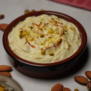 Overhead view of Rajbhog Matho showcasing creamy texture with saffron and nuts garnish