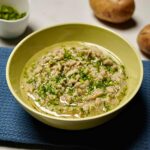 Creamy Gujarati-style mashed potatoes with vibrant green garlic