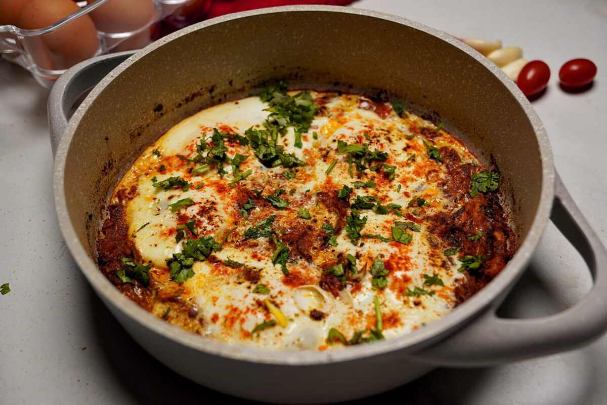 Indian-Style Shakshouka with perfectly poached eggs in spicy tomato gravy