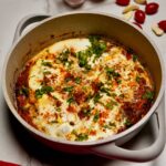 Shakshouka showing vibrant colors and fresh coriander garnish