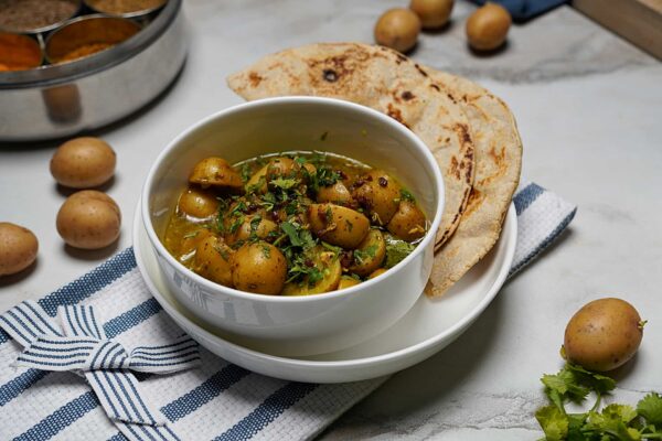 Delicious Aloo Methi Gravy paired with juvar bhakri, a traditional Indian flatbread.