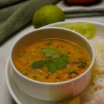Jeera Tadka Wali Dal served in a bowl, showcasing its rich color and texture.