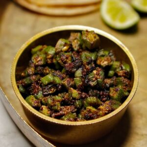Final presentation of Bhinda nu Shaak, a flavorful okra dish garnished on plate.