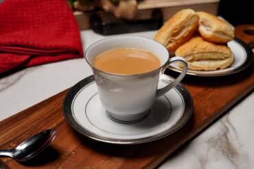 Freshly brewed masala chai with cardamom and ginger, accompanied by traditional khari biscuits.